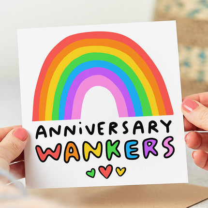 Greeting card with a colourful rainbow illustration and the wording 'Anniversary Wankers' with three hearts.