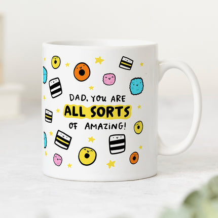Reverse side view of a white ceramic mug with playful liquorice allsorts illustrations and reads 'Dad, You Are All Sorts Of Amazing'.