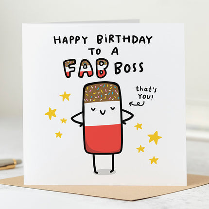 A white folded birthday card featuring a playful image of a classic Fab ice lolly on the front, with the text ,Happy Birthday To A Fab Boss' in bold, eye-catching letters above the image. An arrow is pointing to the ice lolly, with the words "That's You" written next to it.