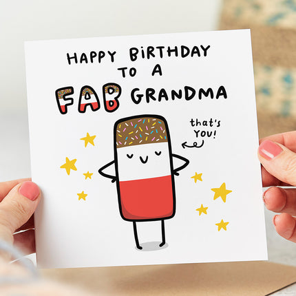 A white folded birthday card with an image of a classic Fab ice lolly on the front. The card reads "Happy Birthday To A Fab Grandma" in bold, eye-catching letters above the image. An arrow is pointing to the ice lolly, with the words "That's You" written next to it.