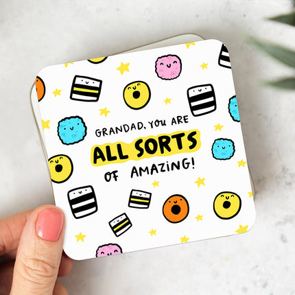 White coaster with playful liquorice allsorts illustrations and reads 'Grandad, You Are All Sorts Of Amazing'.