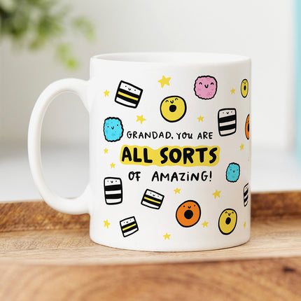 White ceramic mug with playful liquorice allsorts illustrations and reads 'Grandad, You Are All Sorts Of Amazing'.