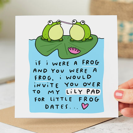 Greeting card with an illustration of two frogs sitting on lily pads, followed by the text 'If I Were A Frog And You Were A Frog, I Would Invite You Over To My Lily Pad For Little Frog Dates'. 