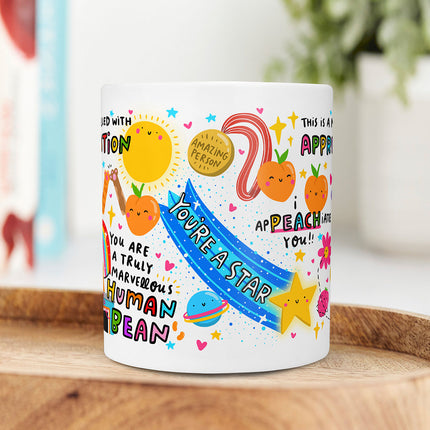 White ceramic mug that reads 'This Is A Mug Filled With Appreciation' surrounded by colourful and playful thank you puns.