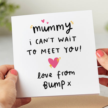 White greeting card that reads 'Mummy I Can't Wait To Meet You Love From The Bump x' with pink hearts.
