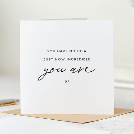 Folded white card that says 'You have no idea just how incredible you are'