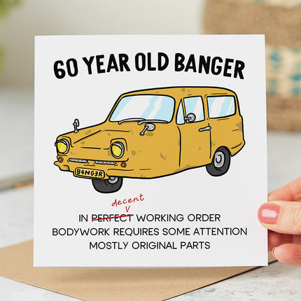 '60 Year Old Banger' birthday card featuring a retro, yellow reliant robin car.
