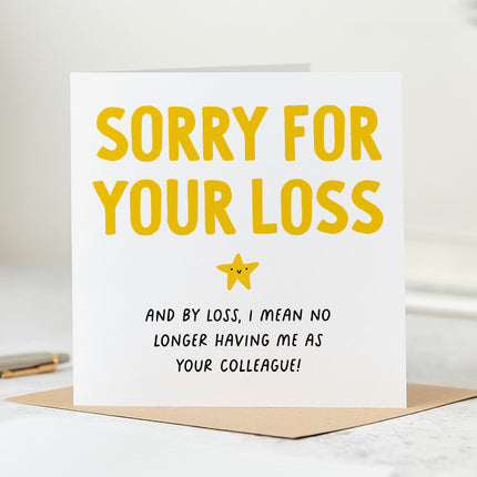 Folded white card that says 'Sorry for your loss and by loss I mean no longer having me as your colleague'