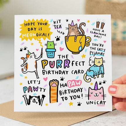 White greeting card that reads 'The Purrfect Birthday Card' and is surrounded by playful cat illustrations and silly cat puns.