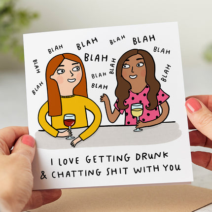 Two friends holding glasses of wine with 'I Love Getting Drunk & Chatting Shit With You' text on a hilarious birthday greeting card.