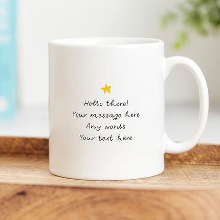 Reverse view of a white ceramic mug with a yellow star on top and a sample of personalised text underneath.